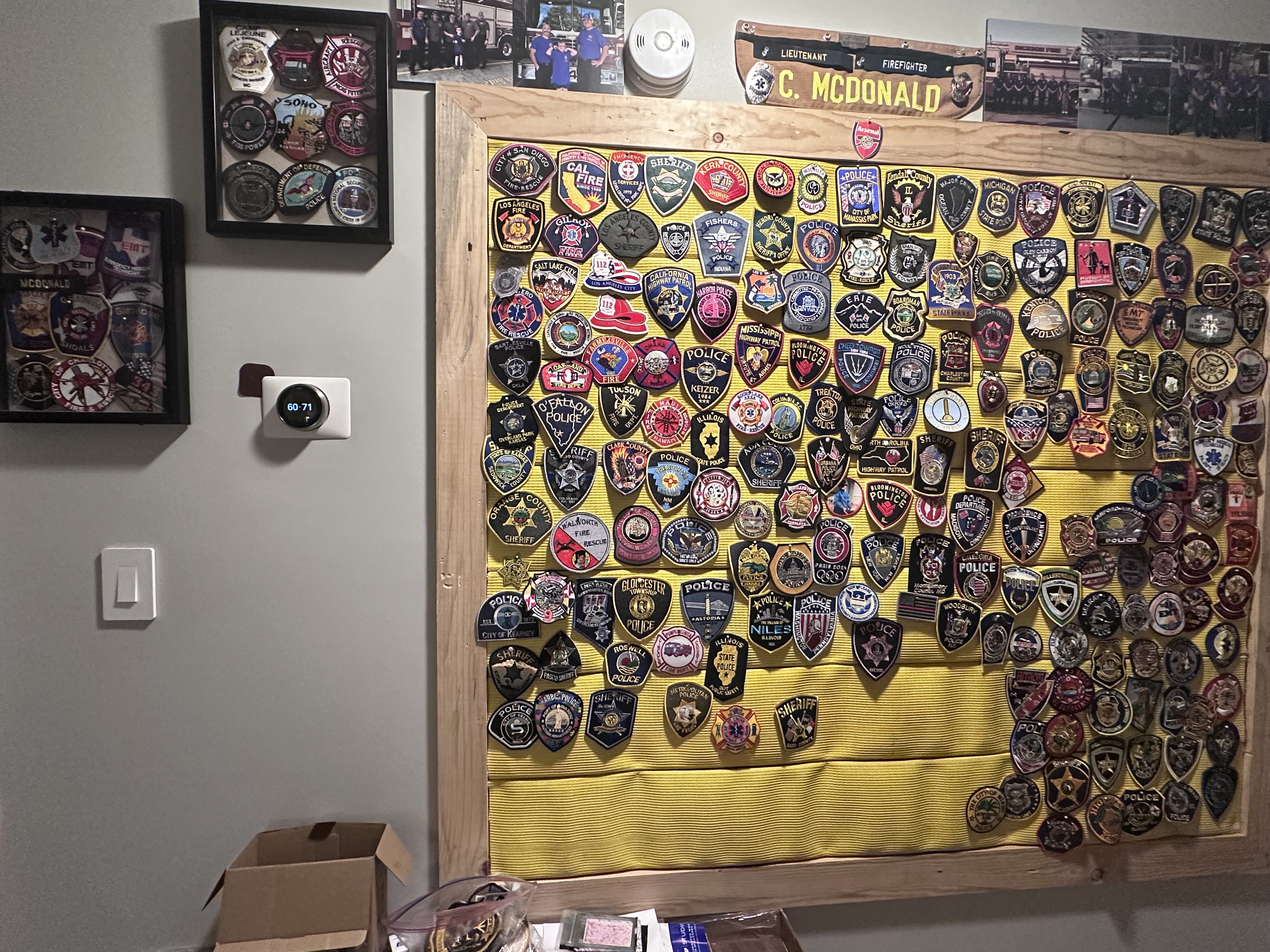 Liam's growing wall of patch collection displays
